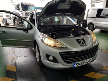 Peugeot 207 undergoing ITV import inspection Peugeot 207 headlights lit